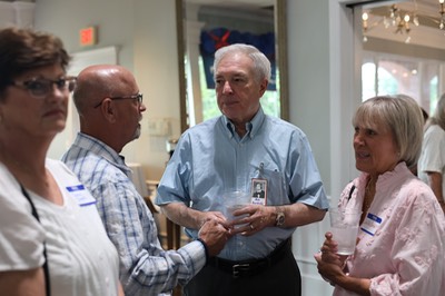 Bill Chappell, Bob Burkett and Leila Walker Burkett '77